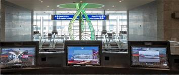 Screens in front of a window at LAX airport.